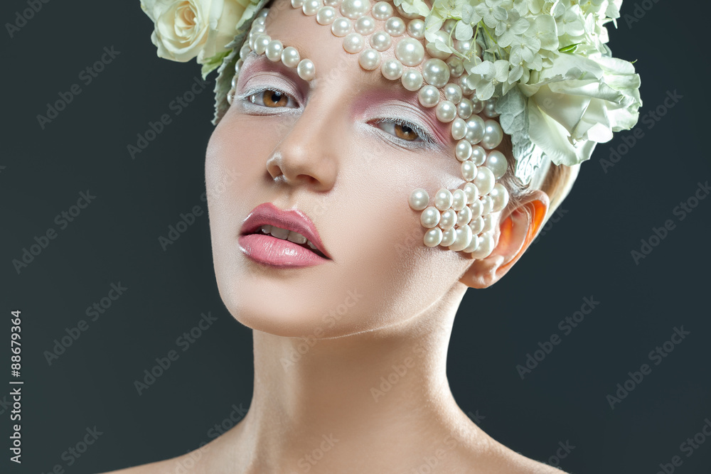 sweet young woman with tender pink and white makeup looking at c