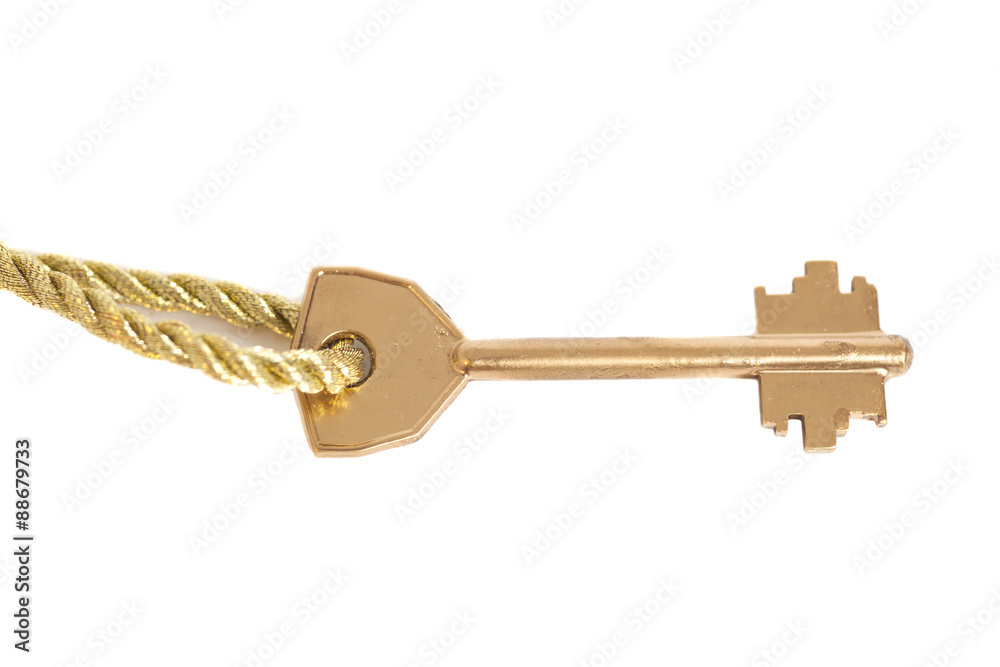 Golden key hanging on gold chain isolated over white Golden key hanging on gold chain isolated over white