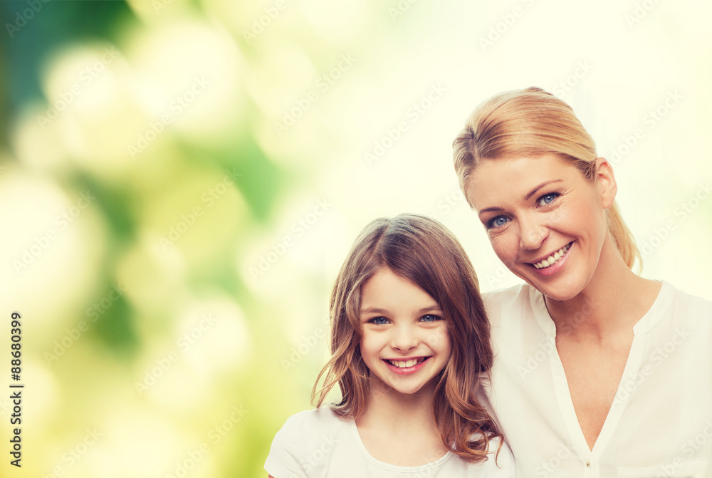 smiling mother and little girl