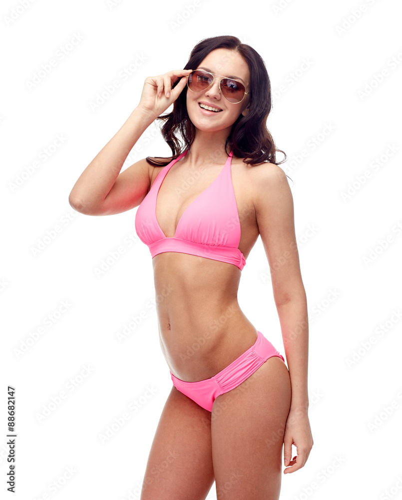 Obraz premium happy woman in sunglasses and bikini swimsuit