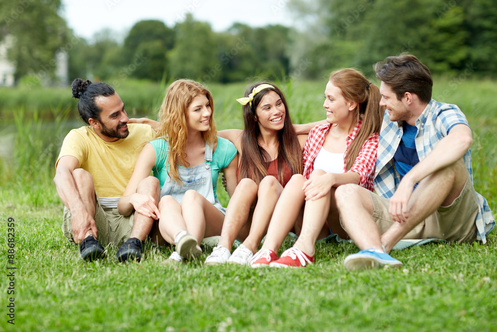 group of smiling friends talking outdoors group of smiling friends talking outdoors