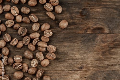 Background coffee. Roasted beans on old wooden background