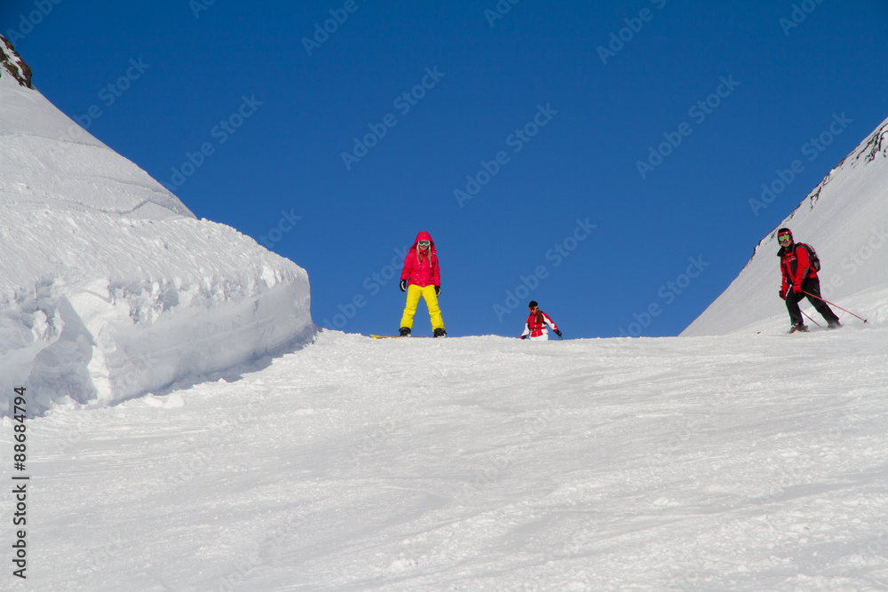 Snowboarders on the mountain slope