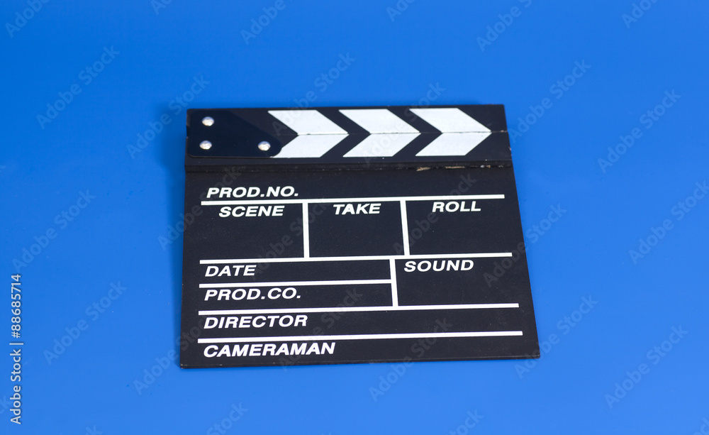 Obraz premium Clapper board on blue background