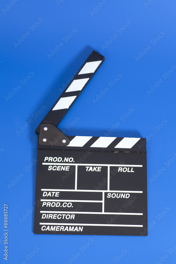 Clapper board on blue background