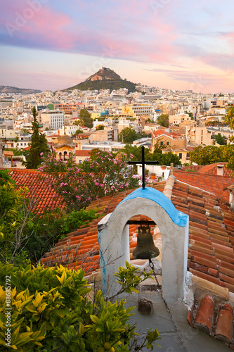 Obraz na płótnie View of Lycabettus hill and a small Greek orthodox church in Anafiotika, Athens. w salonie