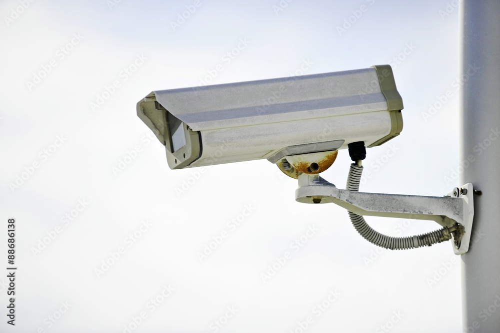 Surveillance camera on a pole Surveillance camera on a pole