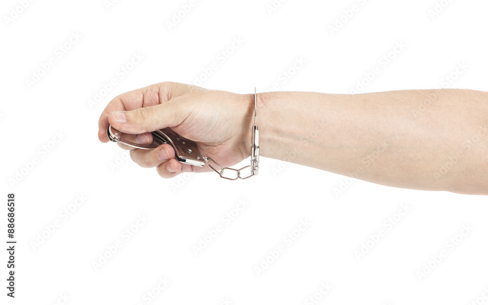 Man hand with handcuffs isolated on white background Man hand with handcuffs isolated on white background