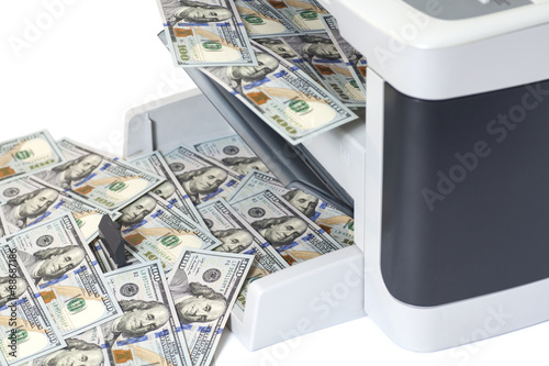 Printer printing fake dollar bills isolated on white background photo
