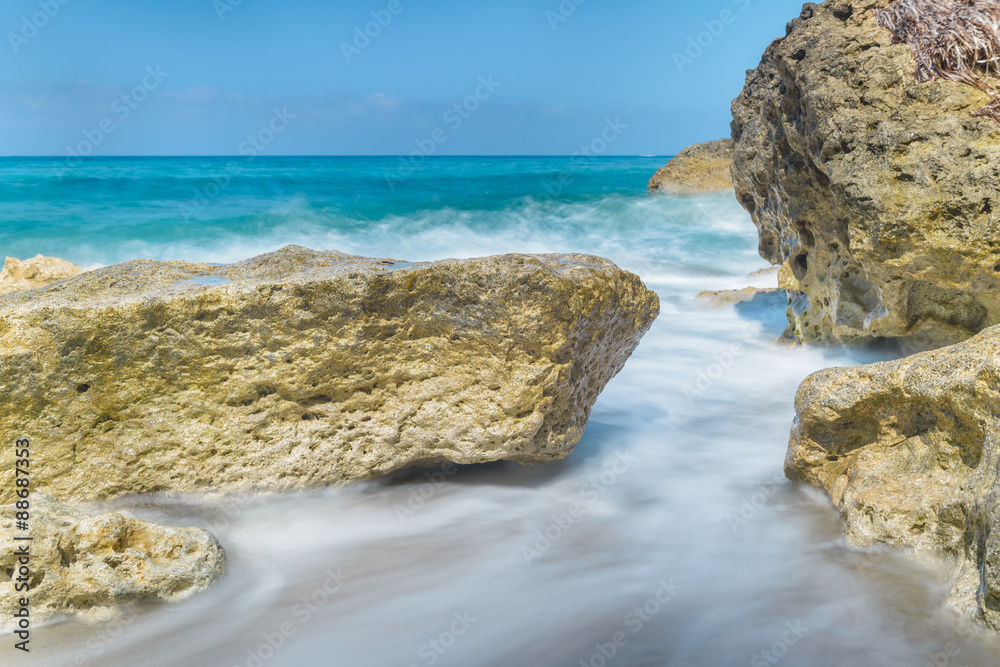 Waves crashing against the rocks at the beach on the Mediterranean island of Cyprus.