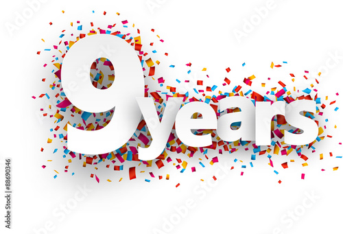 Nine years paper confetti sign.