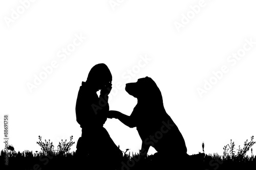 Vector silhouette of a boy with a dog.