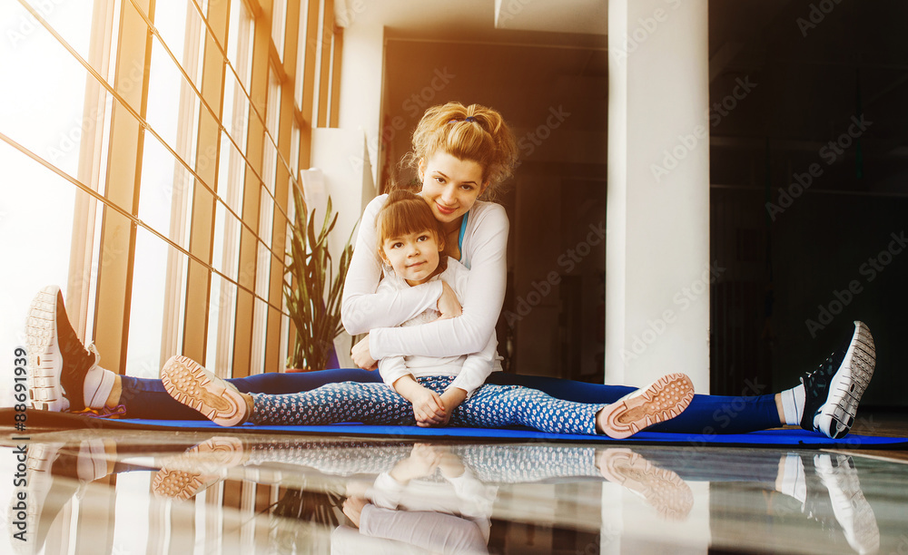 Mother and daughter in the gym Mother and daughter in the gym