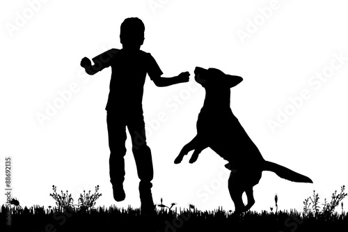 Vector silhouette of a boy with a dog.