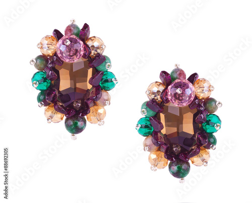 Pair of luxury jewelry earrings with crystals and natural stones isolated on white