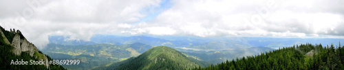 panorama view from ceahlau montains over a valley © astefanei