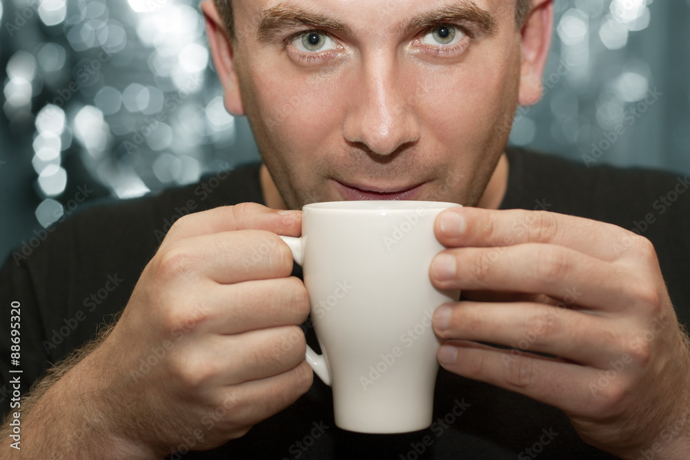 A man drinks coffee A man drinks coffee
