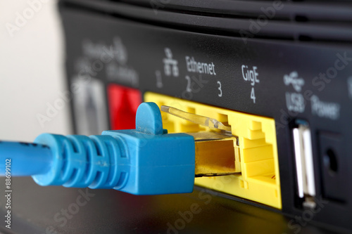 Router modem internet cable.
Home broadband router with cable. photo