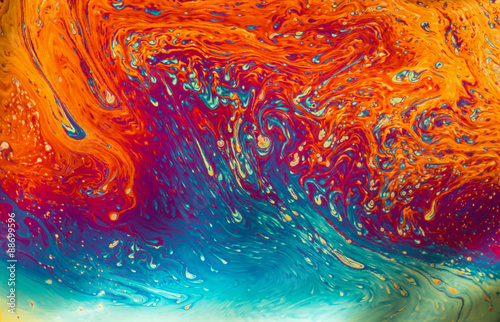 Psychedelic patterns formed on the surface of soap bubbles