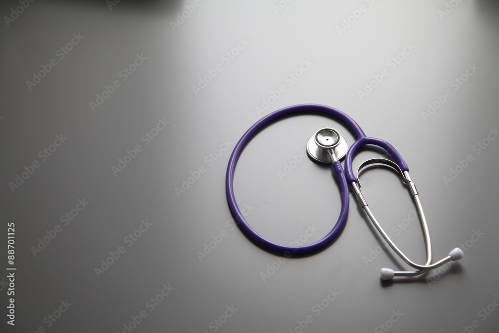 Stethoscope on the grey desk, close up Stethoscope on the grey desk, close up