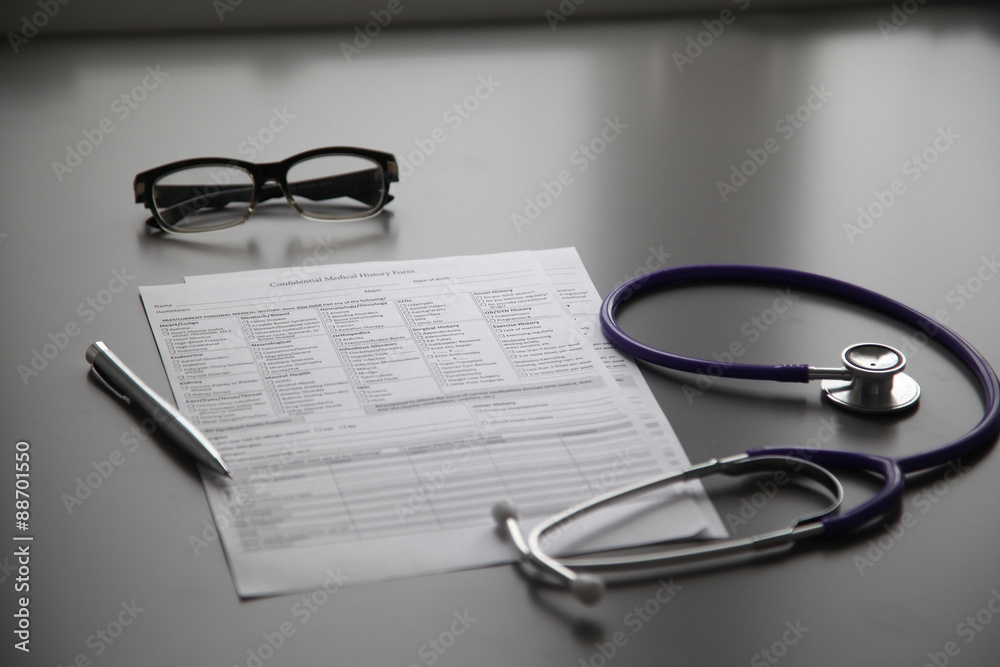 Stethoscope on the grey desk, close up Stethoscope on the grey desk, close up