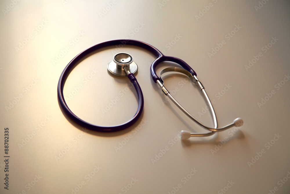 Stethoscope in sun on the desk, close up Stethoscope in sun on the desk, close up