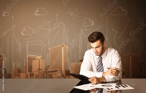 Businessman with buildings and measurements