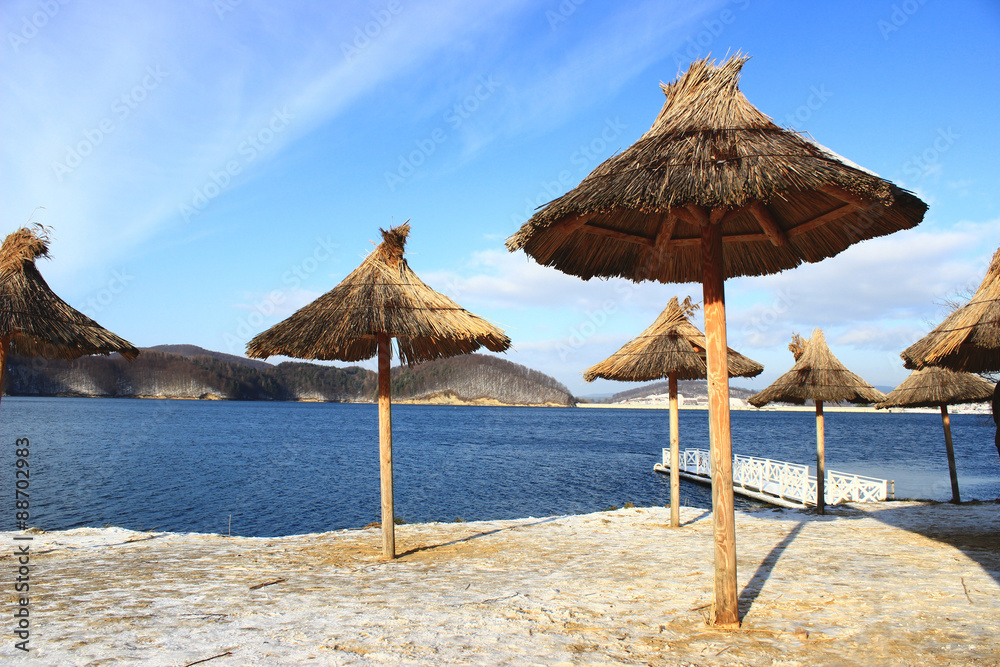 The umbrellas made of straw by the Solina Lake