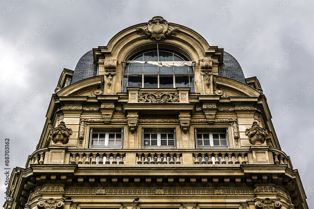 French house with traditional balconies and windows. Paris.