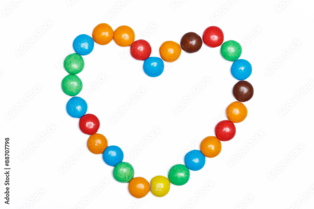 heart frame of colorful candy on a white background with space f heart frame of colorful candy on a white background with space f