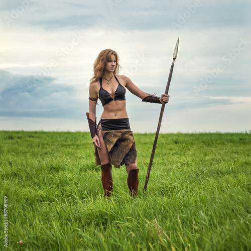 Girl warrior in the field. Amazon on patrol.