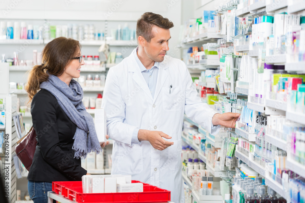 Pharmacist Removing Medicine For Customer