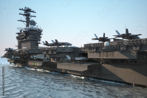 Navy aircraft carrier angled view, with a large compartment of jet aircraft and crew.