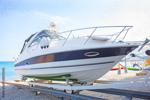 Vászonkép white yacht on support ashore
