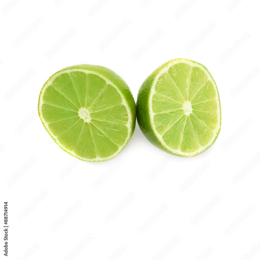 Two halves of a lime fruit isolated over the white background Two halves of a lime fruit isolated over the white background