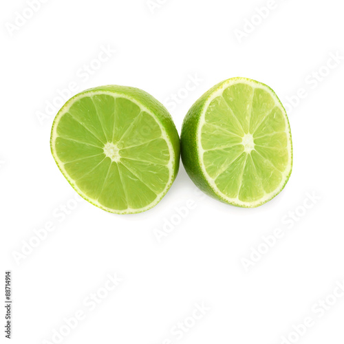 Two halves of a lime fruit isolated over the white background