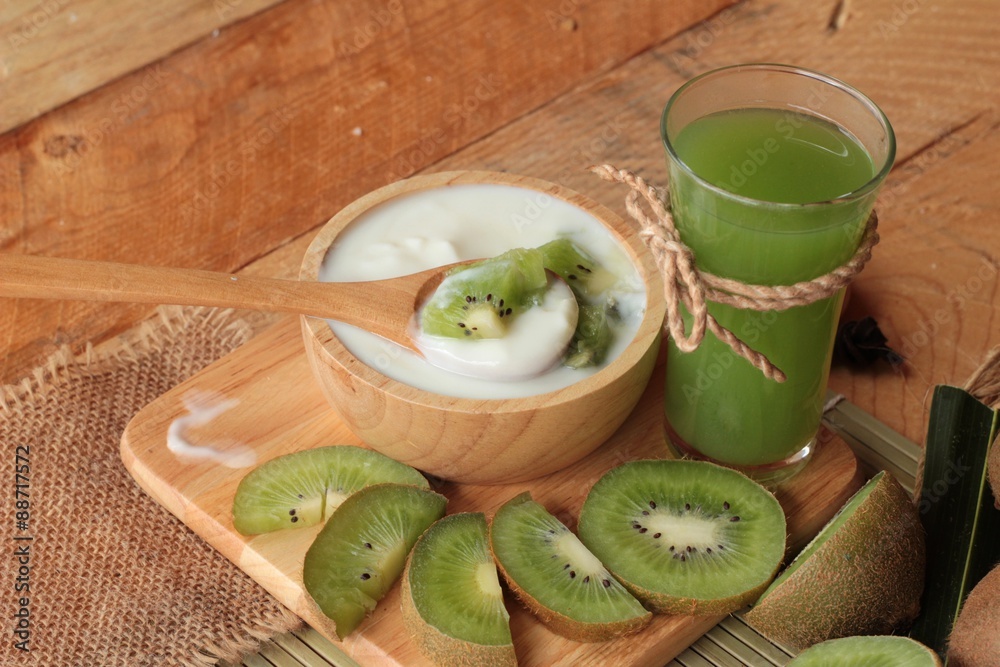 Yogurt white with green kiwi fruit and kiwi juice. Yogurt white with green kiwi fruit and kiwi juice.