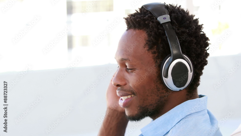 Side view of a hipster man enjoying music Side view of a hipster man enjoying music