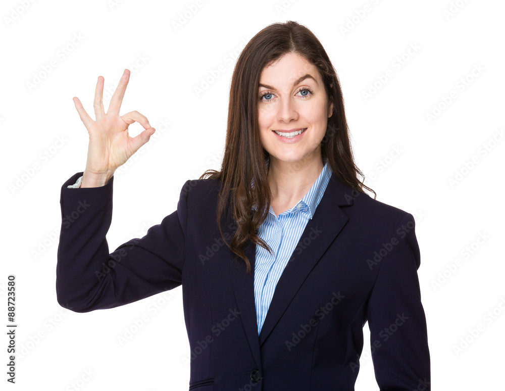 Caucasian young businesswoman with ok sign gesture Caucasian young businesswoman with ok sign gesture