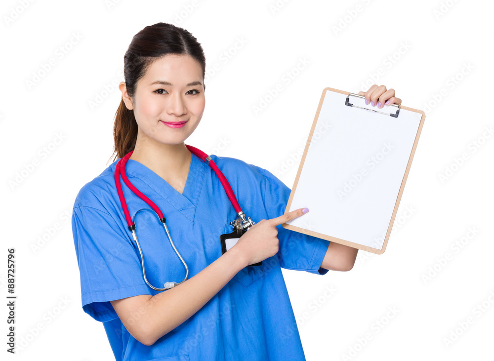 Female doctor finger point to blank paper of clipboard Female doctor finger point to blank paper of clipboard