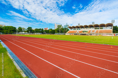 Running track in stadium against blusky photo