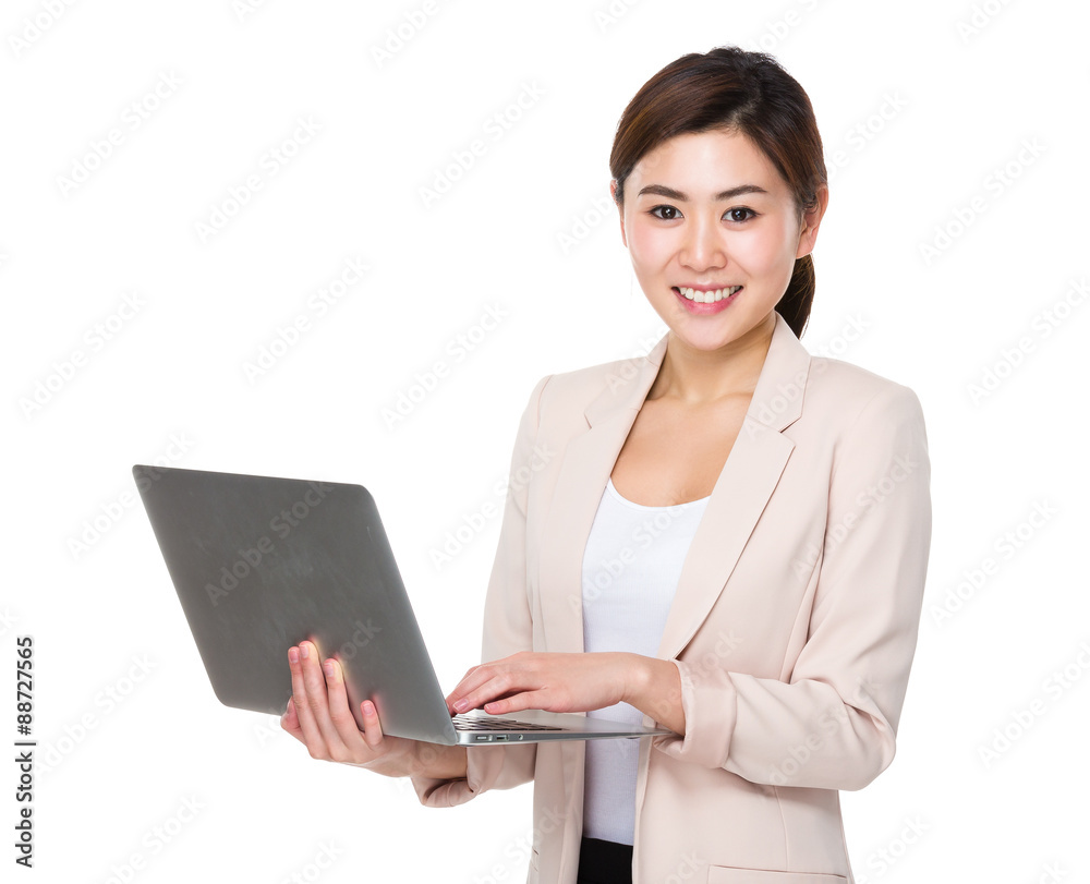 Asian Young businesswoman use of the notebook computer Asian Young businesswoman use of the notebook computer