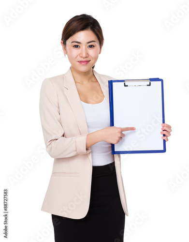 Asian Young businesswoman finger point to clipboard with white p