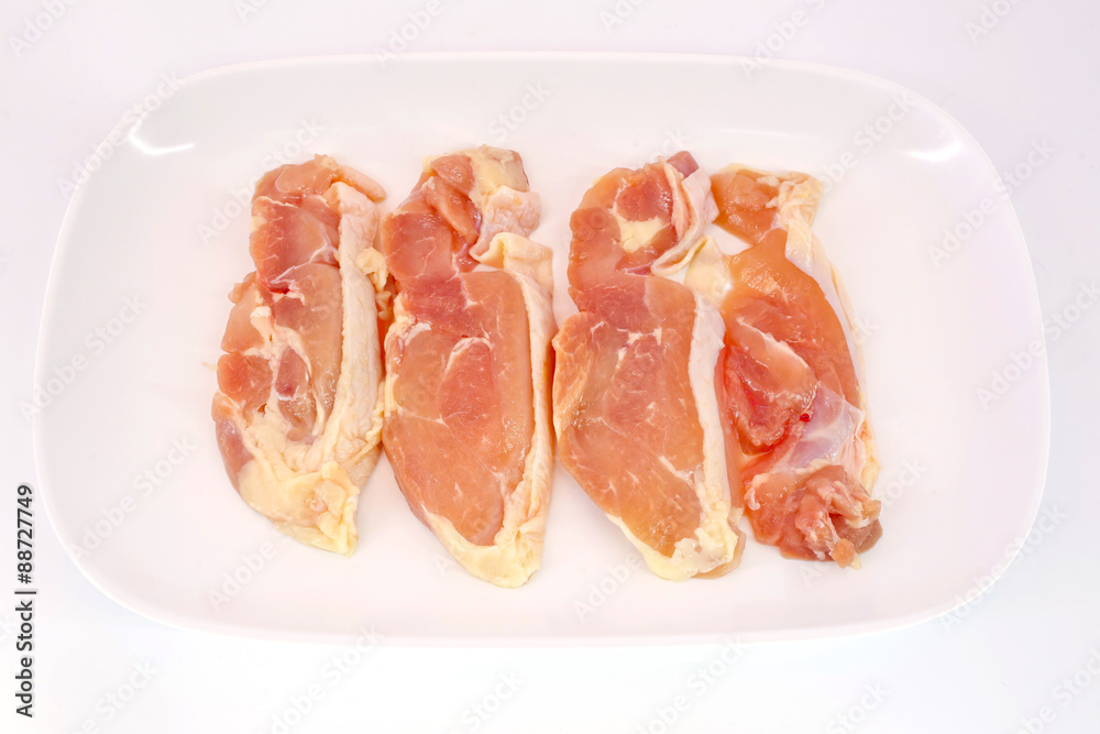 Fresh slices of chicken isoloate on white background ready to be Fresh slices of chicken isoloate on white background ready to be