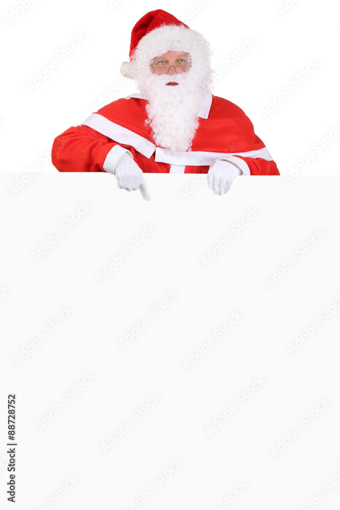 Weihnachtsmann Nikolaus zeigt an Weihnachten auf leeres Schild Weihnachtsmann Nikolaus zeigt an Weihnachten auf leeres Schild