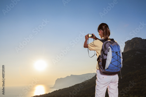 Tourist takes photo on nature