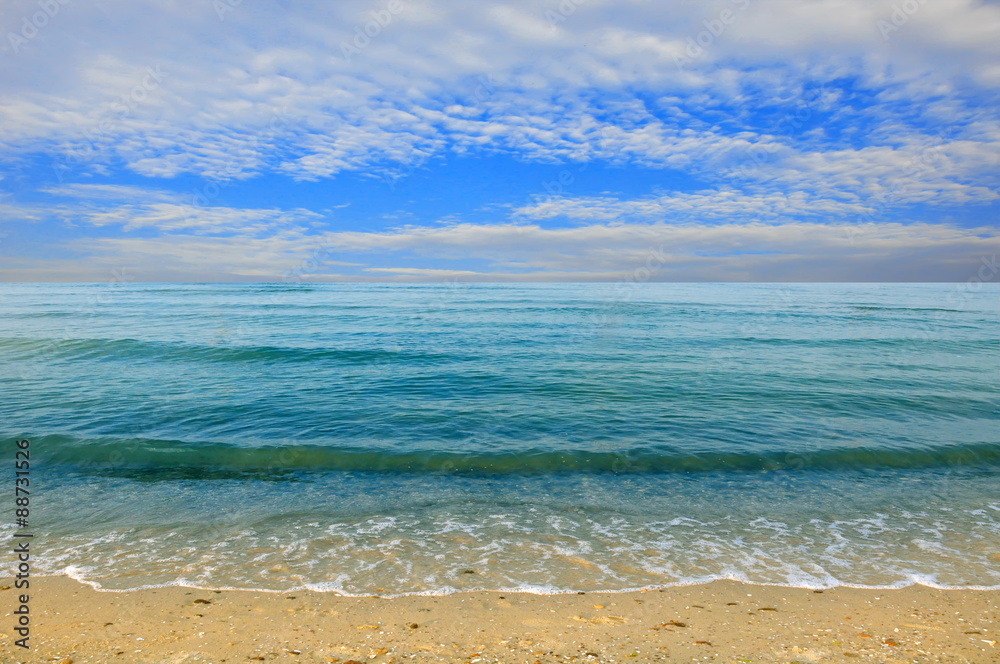 Fototapeta premium Black sea beach blue sky sand sun daylight