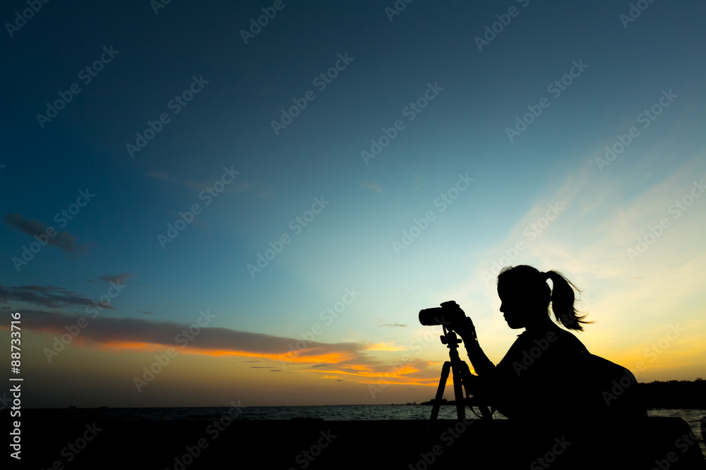Silhouette of photographer at sunset.