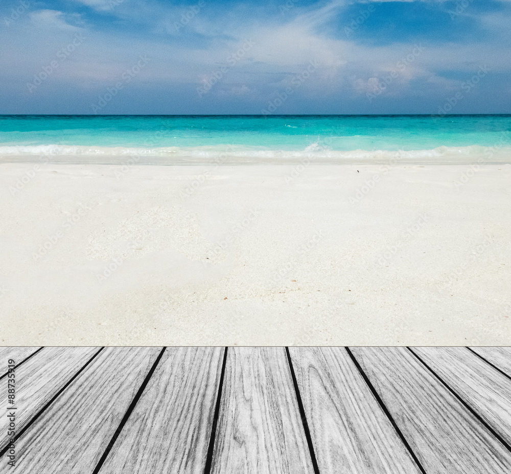 Fototapeta premium Wood Terrace on The Beach with Clear Sky,Blue Sea and White Sand to input Text