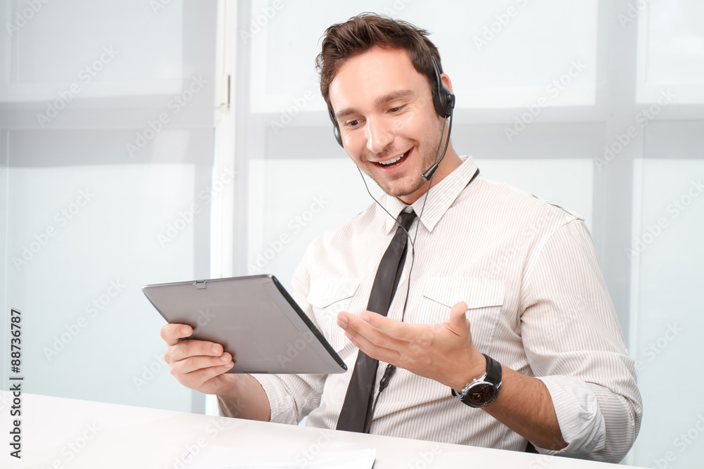 Call center operator holding laptop Call center operator holding laptop